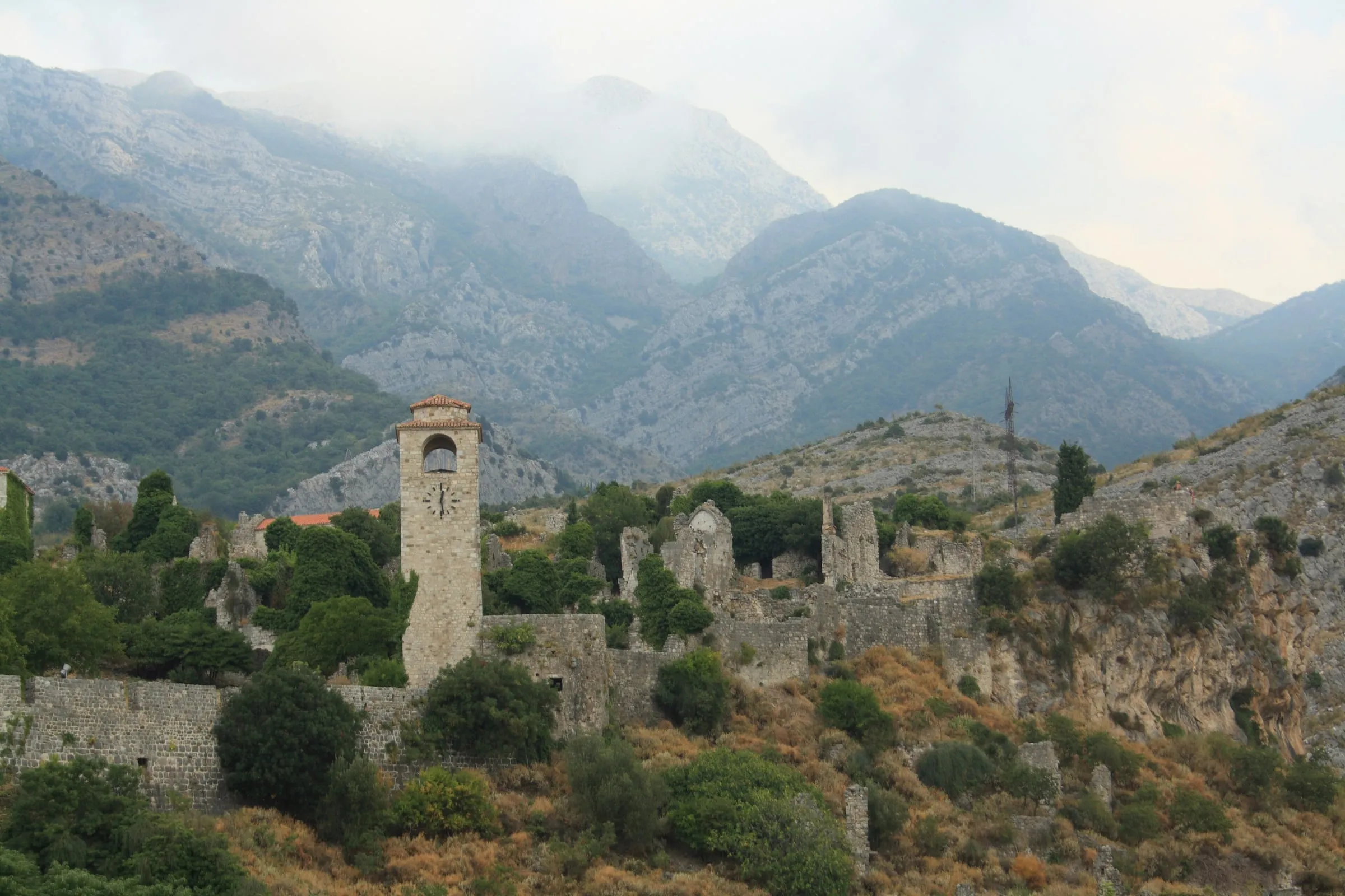 Stari Bar ruins and clock tower below the mountains